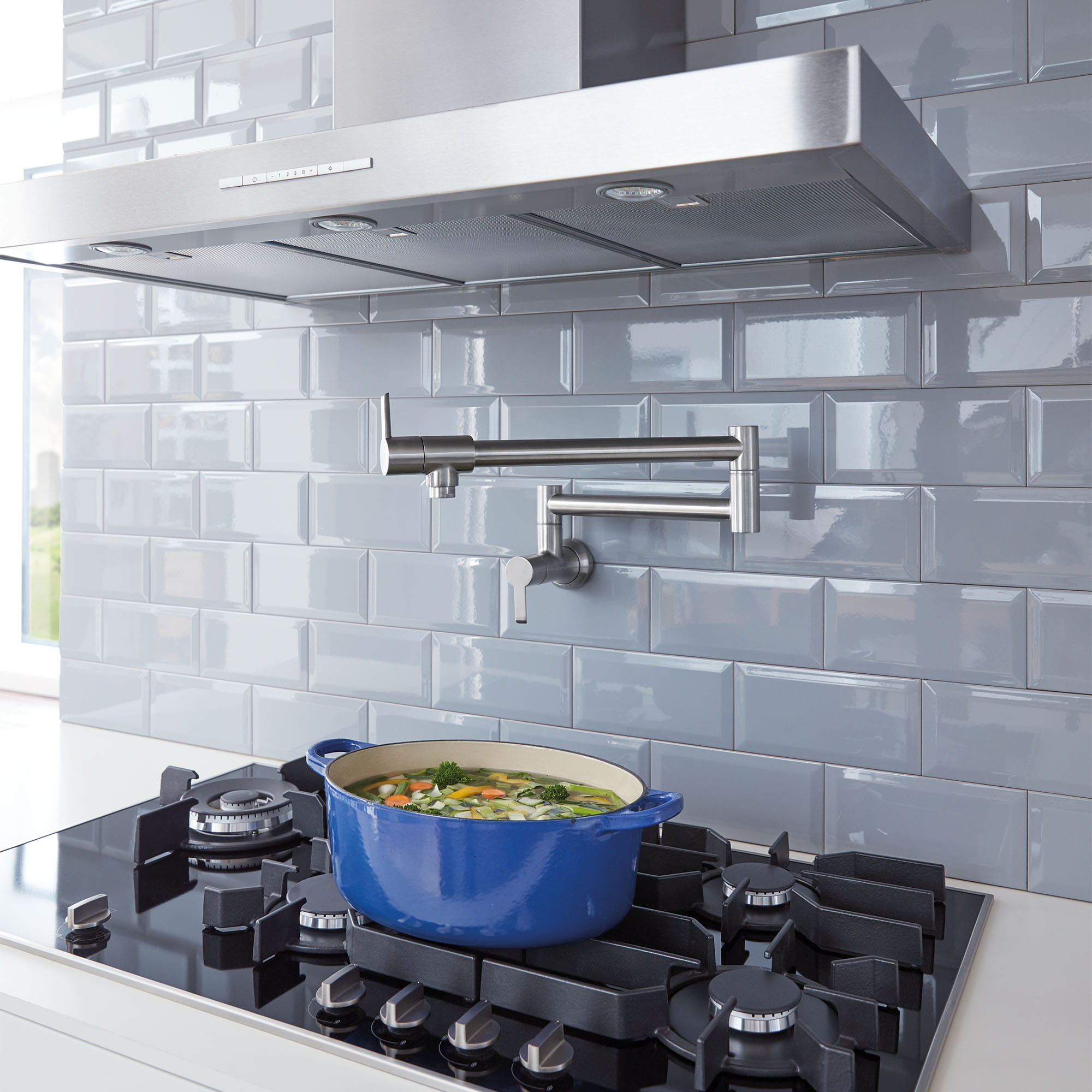 white-subway-tile-is-a-cheap-way-to-add-a-dramatic-backsplash-to-a